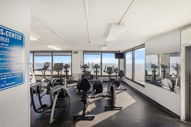 gym with a textured ceiling