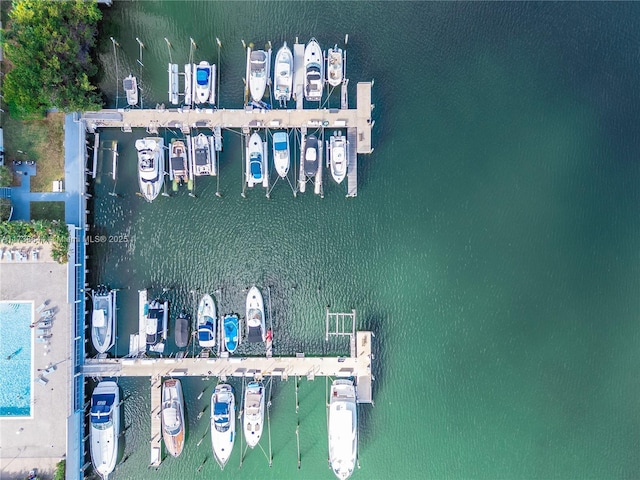 birds eye view of property with a water view