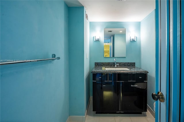 bathroom with tile patterned floors and vanity