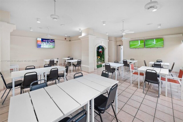 tiled dining room with ceiling fan