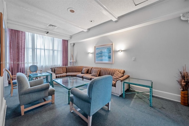 living room with beamed ceiling and a textured ceiling