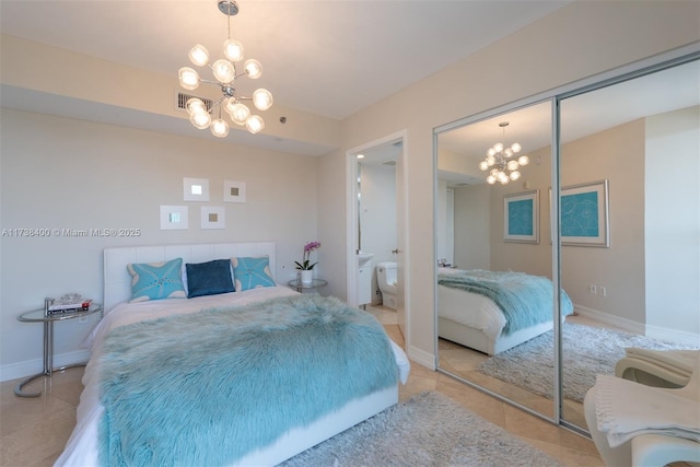 tiled bedroom with a chandelier and a closet