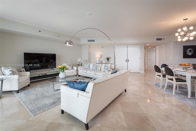 living room featuring an inviting chandelier