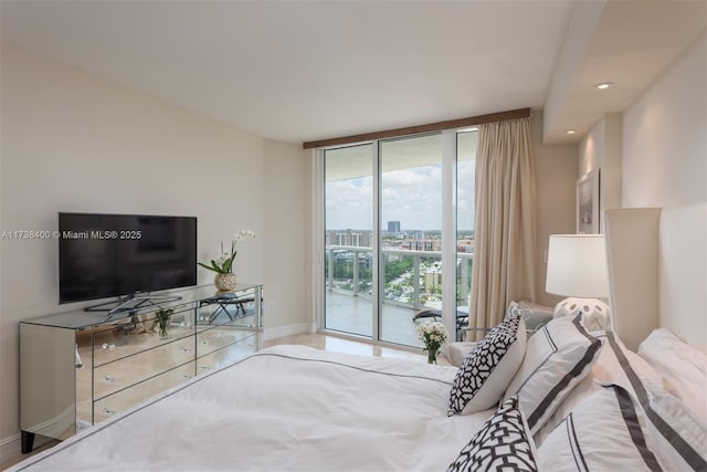 bedroom featuring access to exterior and expansive windows