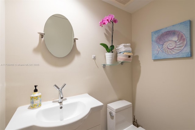 bathroom featuring sink and toilet