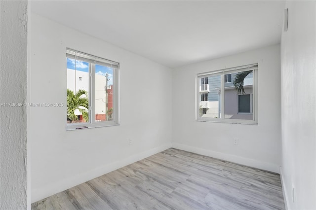 unfurnished room featuring light hardwood / wood-style flooring