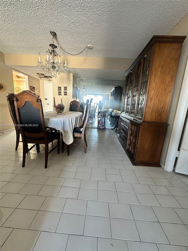 dining area with a textured ceiling and a notable chandelier