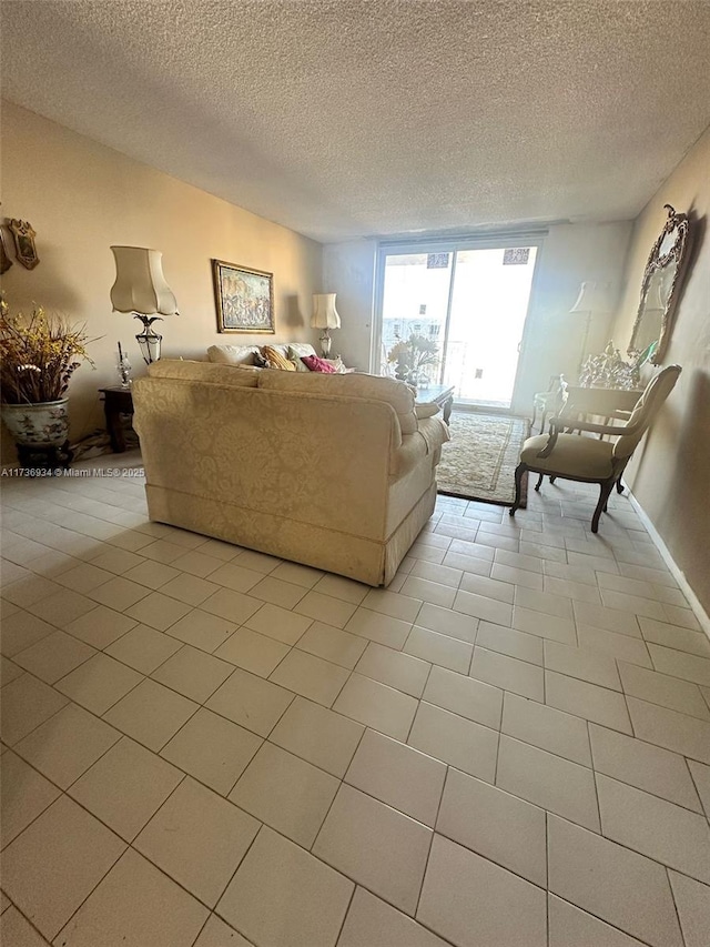 unfurnished living room featuring light tile patterned flooring and a textured ceiling