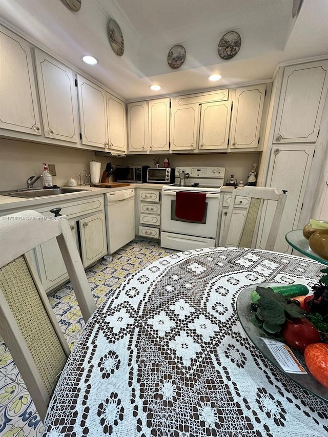 kitchen with sink and white appliances