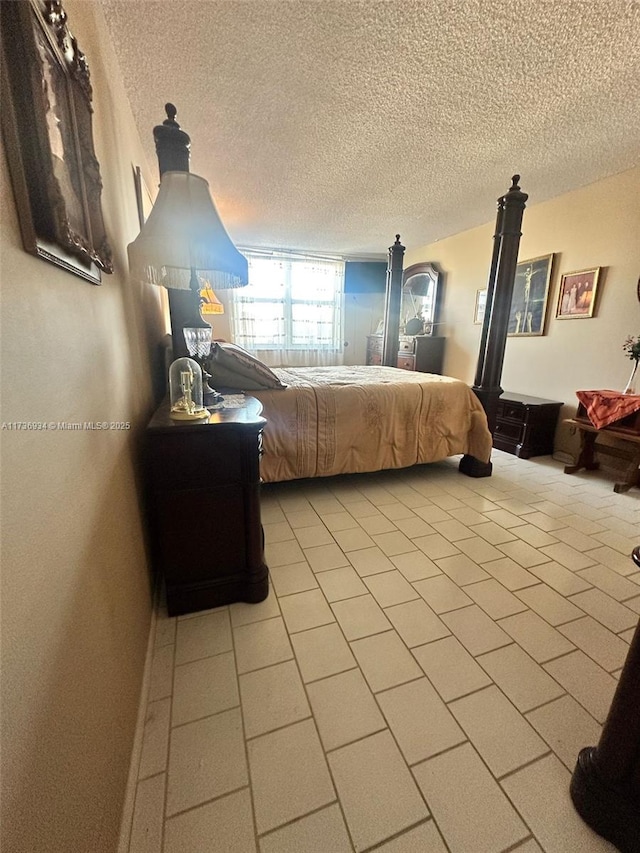 bedroom featuring a textured ceiling