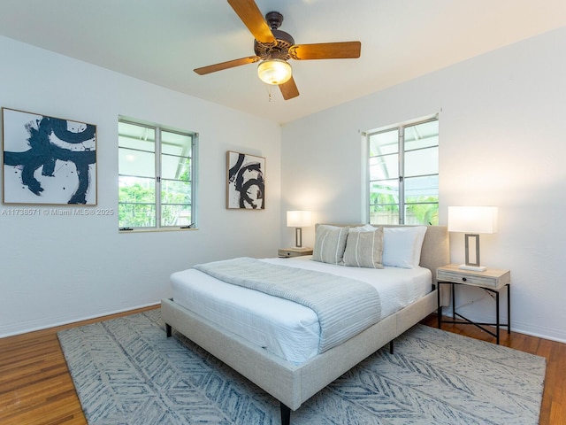 bedroom featuring hardwood / wood-style flooring and ceiling fan