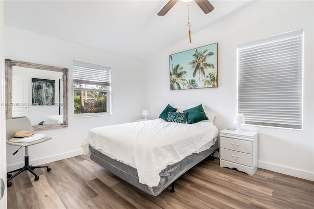 bedroom featuring lofted ceiling, wood-type flooring, and ceiling fan