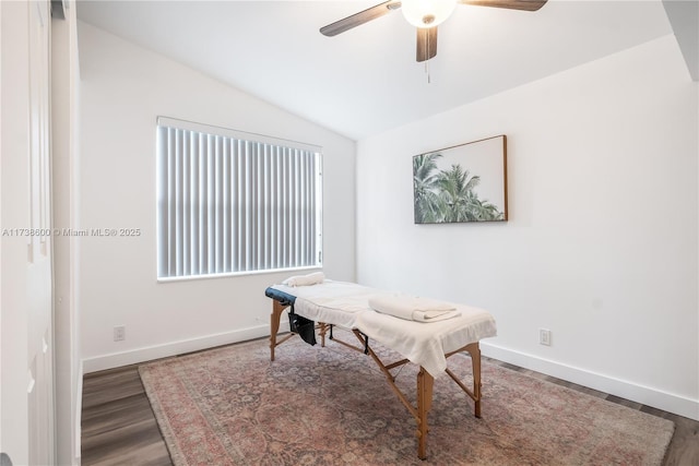 office area with vaulted ceiling, dark hardwood / wood-style floors, and ceiling fan