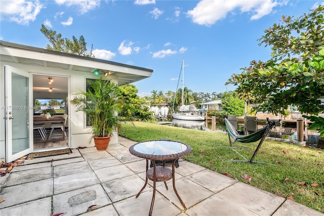 view of patio featuring a water view