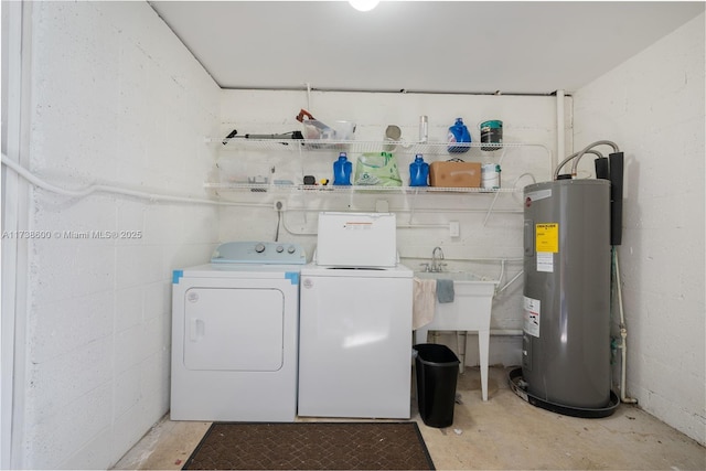 laundry area with washer and clothes dryer and electric water heater