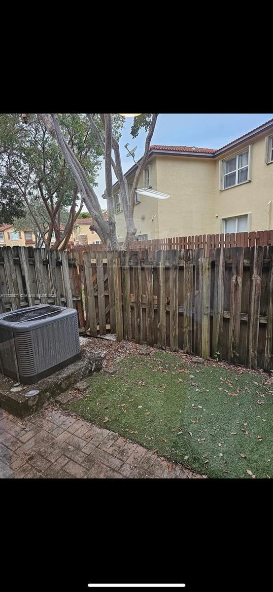 view of yard with central air condition unit