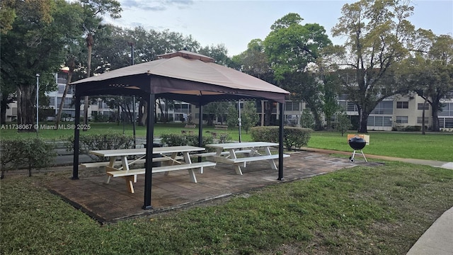 view of property's community featuring a gazebo and a lawn