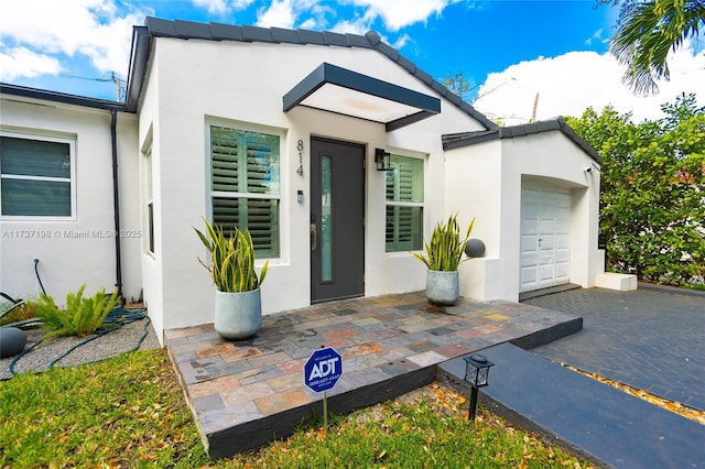 view of front of property with a garage