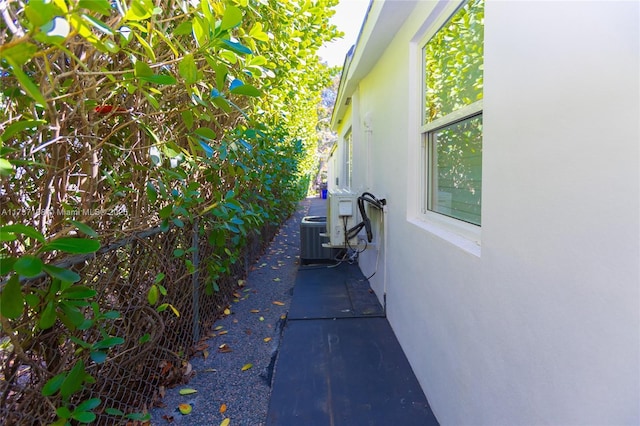 view of side of property with cooling unit