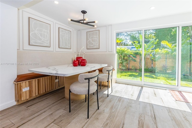 dining area featuring light hardwood / wood-style floors and breakfast area