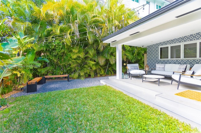 view of yard with an outdoor hangout area and a patio