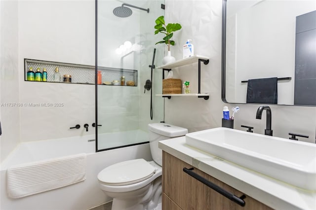 full bathroom featuring vanity, shower / bath combination with glass door, and toilet