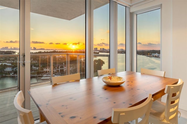 dining room featuring a water view