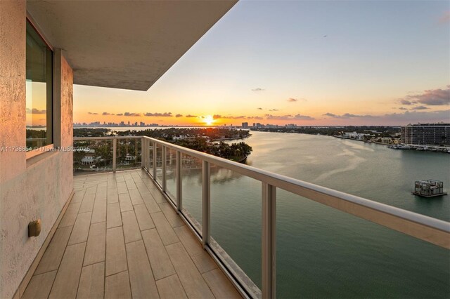 balcony at dusk with a water view