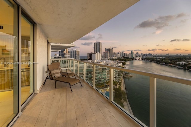 balcony at dusk with a water view