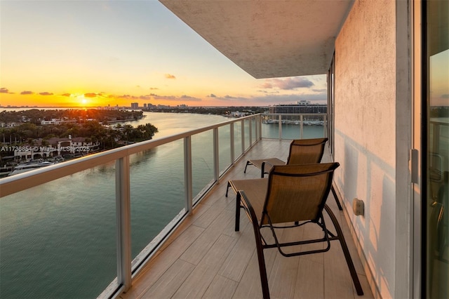 balcony at dusk with a water view