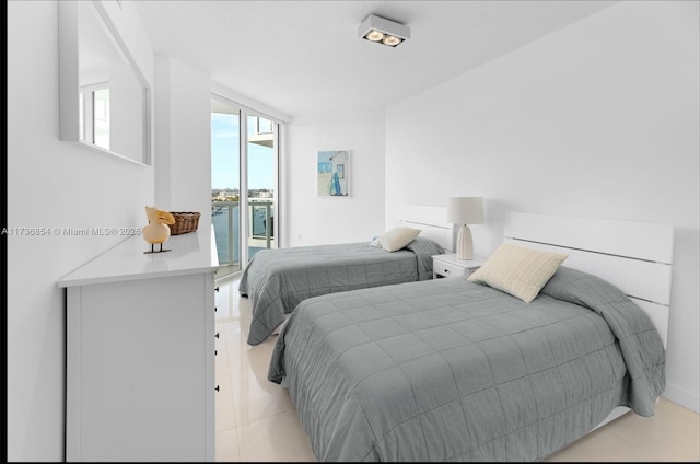 bedroom with access to exterior, light tile patterned floors, and floor to ceiling windows