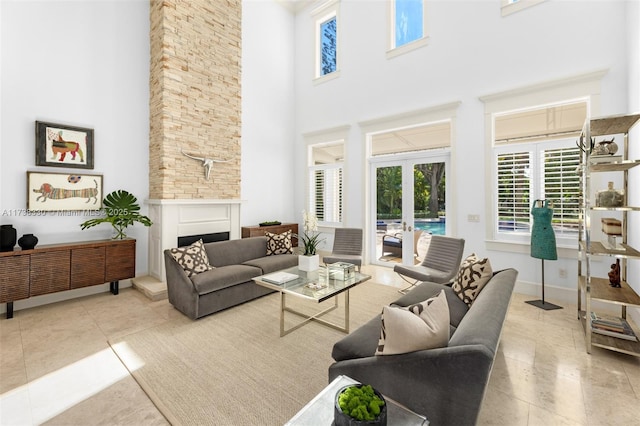 tiled living room with french doors and a towering ceiling