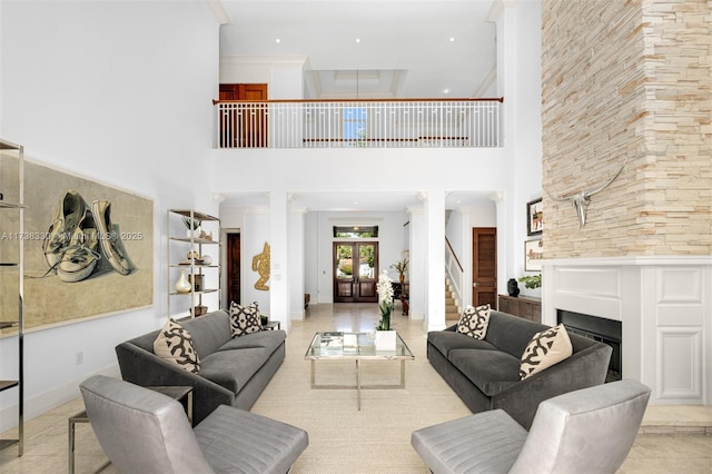 living room featuring a high ceiling, crown molding, and french doors