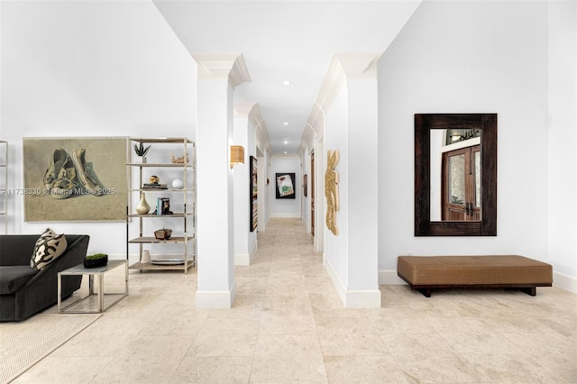 corridor with tile patterned flooring and crown molding