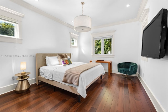 bedroom with multiple windows, crown molding, and dark hardwood / wood-style floors