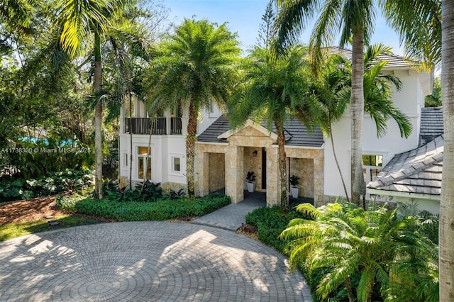 view of front of home with a balcony