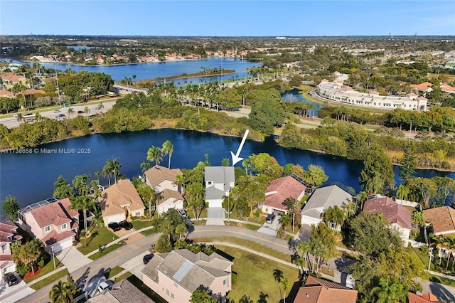 birds eye view of property featuring a water view