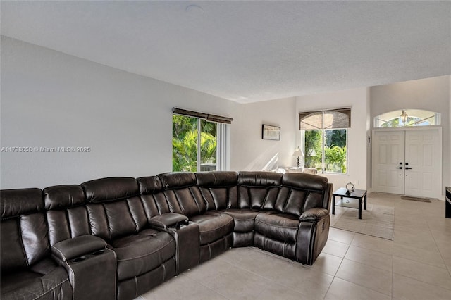 tiled living room featuring a wealth of natural light