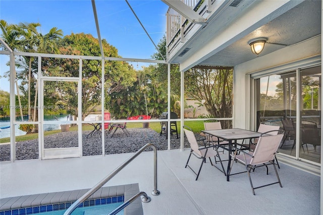 unfurnished sunroom with a water view