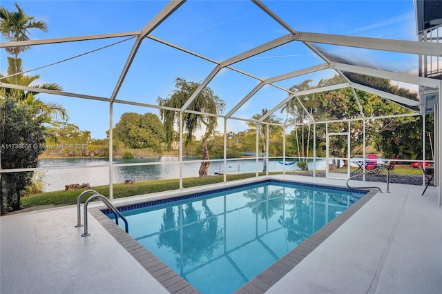 view of swimming pool with a patio, glass enclosure, and a water view