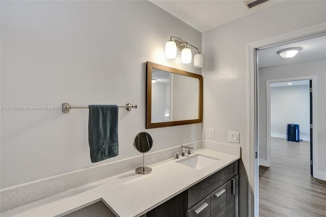 bathroom featuring vanity and hardwood / wood-style floors