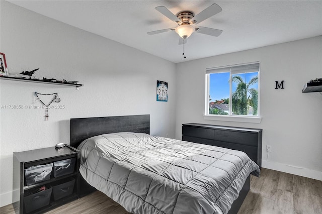 bedroom featuring ceiling fan and hardwood / wood-style floors