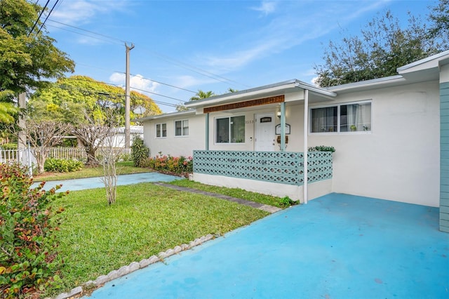 ranch-style house with a front yard