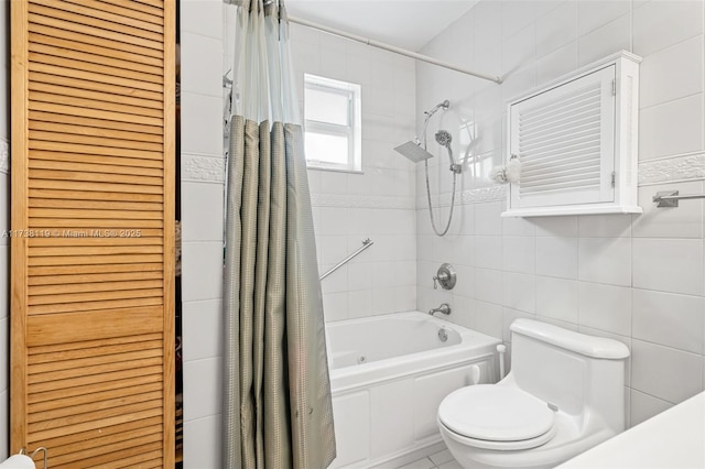 bathroom featuring tile walls, shower / bathtub combination with curtain, and toilet