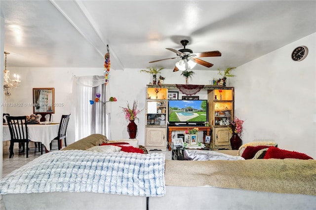 living area featuring ceiling fan with notable chandelier and light tile patterned flooring