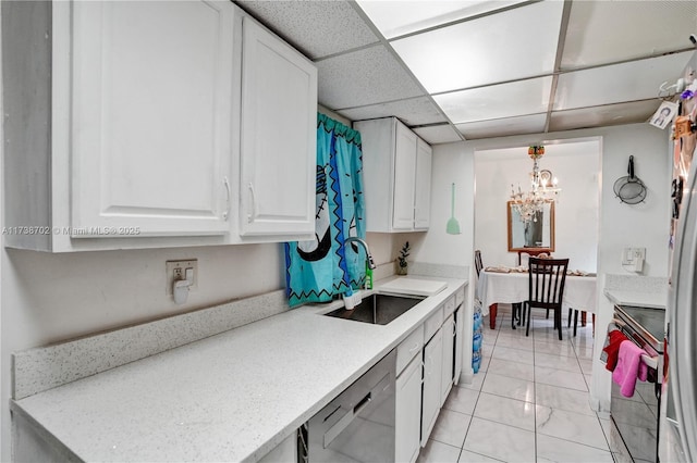 kitchen featuring electric range, a sink, white cabinets, light countertops, and dishwasher