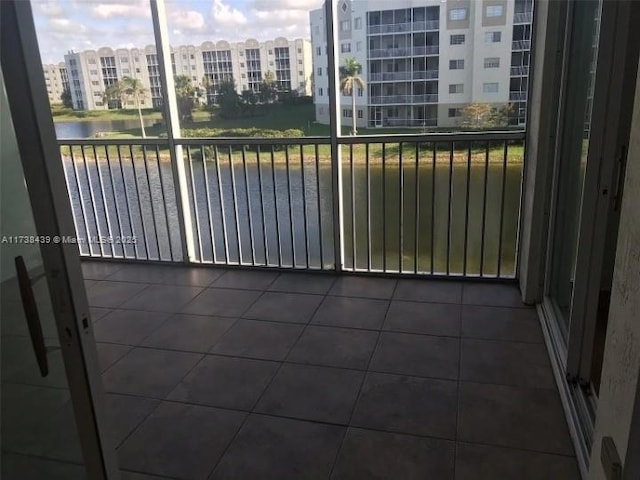 balcony featuring a water view