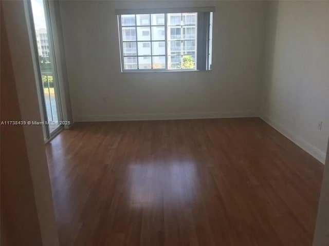 empty room featuring dark hardwood / wood-style floors