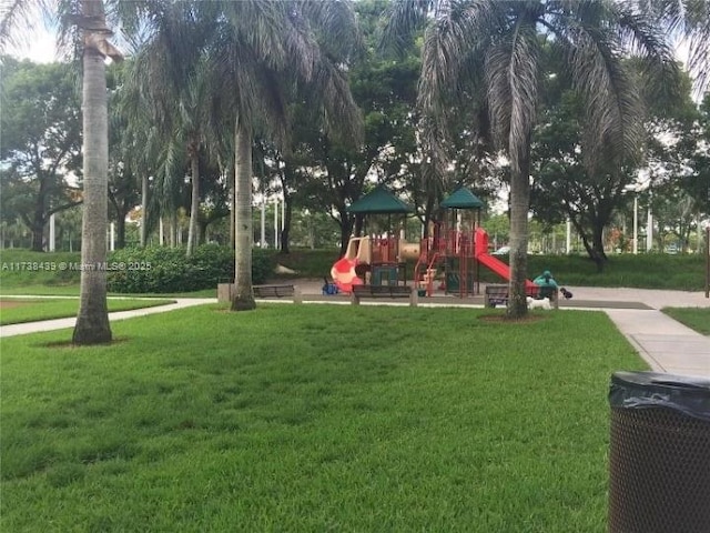 view of jungle gym featuring a lawn