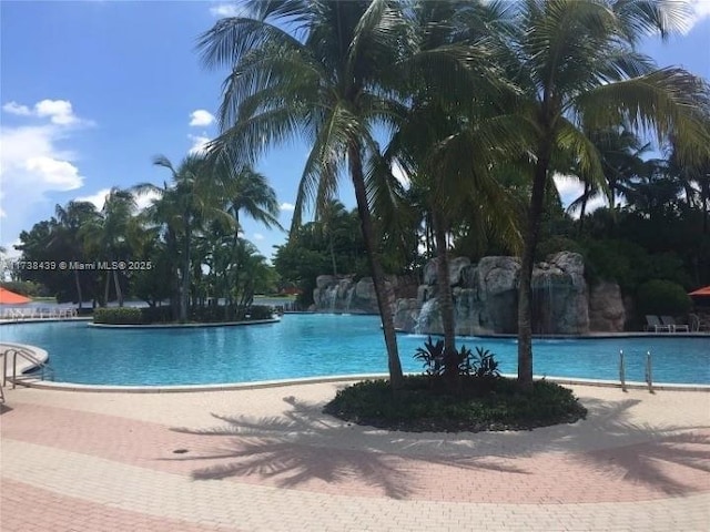 view of swimming pool featuring pool water feature